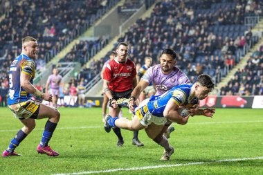 Leeds Rhinos takımından Jack Sinfield, 22 Mart 2025 tarihinde Leeds, İngiltere 'deki Headingley Stadyumu' nda oynanan Betfred Süper Lig 5. Round karşılaşmasında skoru 10-10 'a çıkardı.