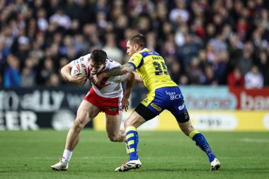 St. Helens 'li Tristan Sailor, Betfred Süper Lig 5. Raundu' nda St Helens - Warrington Wolves maçı sırasında Warrington Wolves 'tan Marc Sneyd ile karşı karşıya geldi.