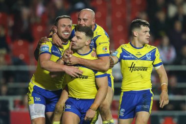 Warrington Wolves 'tan George Williams, 21 Mart 2025' te St Helens vs Warrington Wolves 'a karşı oynanan Betfred Süper Lig maçında 2-4' lük galibiyetini kutluyor.
