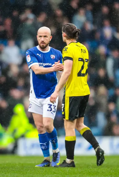 Chesterfield 'dan Paddy Madden ve Harrogate Town' dan James Ben Fox, 22 Mart 2025 'te SMH Group Stadiumact Stadyumu' nda oynanan Sky Bet 2 karşılaşmasında tam zamanlı olarak el sıkışıyorlar.