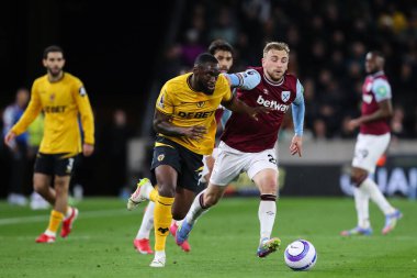 Wolverhampton Wanderers 'dan Toti Gomes, 1 Nisan 2025 tarihinde İngiltere' nin Wolverhampton kentinde oynanan Premier League karşılaşmasında West Ham Wanderers - West Ham United maçında Jarrod Bowen 'ı durdurdu.