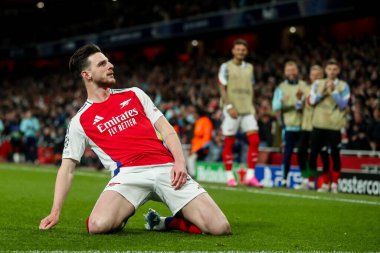 Arsenal 'den Declan Rice, UEFA Şampiyonlar Ligi çeyrek final maçı Arsenal' in Real Madrid 'e karşı Emirates Stadyumu, Londra, İngiltere' de 8 Nisan 2025 'te oynanan karşılaşma maçında 1-0' lık galibiyet golünü kutluyor.