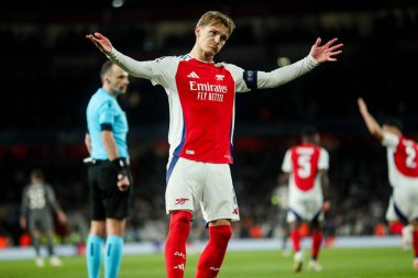 Arsenal 'den Martin Odegaard, UEFA Şampiyonlar Ligi çeyrek final maçında takımın ikinci golünü kutluyor. Arsenal, Real Madrid' e karşı Emirates Stadyumu, Londra, İngiltere, 8 Nisan 2025
