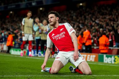 Arsenal 'den Declan Rice, UEFA Şampiyonlar Ligi çeyrek final maçı Arsenal' in Real Madrid 'e karşı Emirates Stadyumu, Londra, İngiltere' de 8 Nisan 2025 'te oynanan karşılaşma maçında 1-0' lık galibiyet golünü kutluyor.
