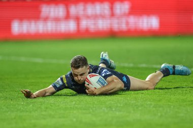 Wigan Warriors 'dan Jai sahası, 11 Nisan 2025' te İngiltere 'nin Hull-Wigan Warriors takımına karşı oynanan Betfred Süper Lig 7' nci raundunda 12-20 'lik galibiyet elde etmeye çalışıyor.