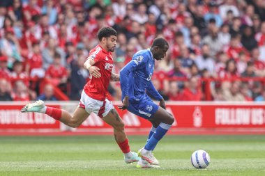 Nottingham Ormanı 'ndan Abdoulaye Doucour ve Nottingham Ormanı' ndan Morgan Gibbs-White Premier Lig maçı sırasında Nottingham Forest, Everton 'a karşı 12 Nisan 2025' de City Ground, Nottingham, İngiltere 'de oynadılar.