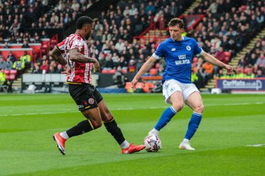 Sheffield United takımından Tyrese Campbell, 18 Nisan 2025 'te Sheffield Lane, Sheffield, İngiltere' de oynanan Sky Bet Şampiyonası karşılaşmasında Cardiff City 'li William Fish' e karşı mücadele etti.