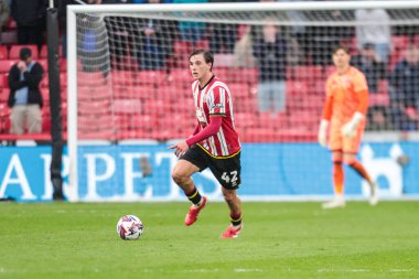 Sheffield United takımından Billy Blacker, 18 Nisan 2025 'te Sheffield United' ın Cardiff City 'e karşı oynadığı Sky Bet Şampiyonası maçında topu bırakıyor.