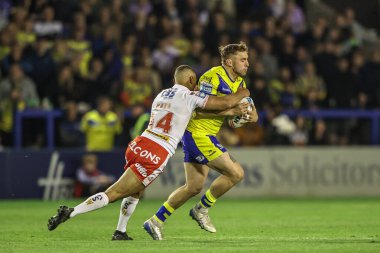 Warrington Wolves 'tan Sam Powell, Betfred Süper Lig 9. Maçı' nda 9. Warrington Wolves St. Helens 'e karşı Halliwell Jones Stadyumu, Warrington, Birleşik Krallık' ta 24 Nisan 2025 'te oynanan karşılaşmada St. Helens' li Moses Mbye 'e yenildi.
