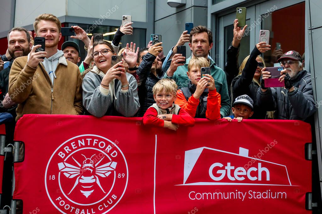 Fans wait for player arrivals prior to the Premier League match Brentford vs Manchester United at The Gtech Community Stadium, London, United Kingdom, 4th May 2025