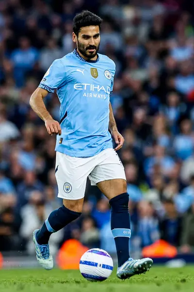 Manchester City 'den Ilkay Gundogan 20 Mayıs 2025 tarihinde Etihad Stadyumu' nda Manchester City ile Bournemouth arasındaki Premier League maçında topla koşuyor.