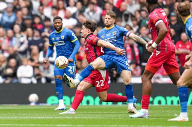 AFC Wimbledon 'dan Jake Reeves topu Walsall' dan Jamie Jellis 'in üzerinden 26 Mayıs 2025' te Wembley Stadyumu 'nda oynanan Wimbledon-Walsall maçında kazandı.