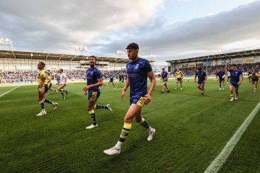 Warrington oyuncuları maç öncesi ısınma turunda 21. Betfred Süper Ligi karşılaşmasında Warrington Wolves Wigan Warriors 'a karşı Halliwell Jones Stadyumu, Warrington, İngiltere, 8 Ağustos 2025