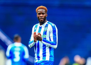 Sheffield 'li Ik Ugbo Çarşamba günü Sheffield Çarşamba günü İngiltere' nin başkenti Sheffield 'da oynanan Stoke City maçında taraftarları alkışlıyor.