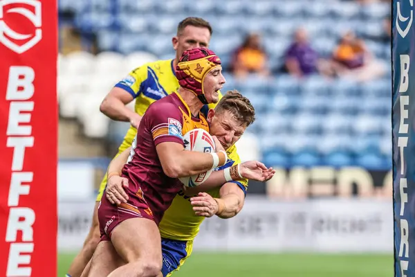 Huddersfield Giants takımından George Flanagan, Betfred Süper Lig 23. Raundu 'nda George Williams ile Accu Stadyumu' nda oynanan Huddersfield Giants vs Warrington Wolves maçında rakibini yendi.