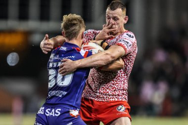 Jayden Myers of Wakefield Trinity tackled by Frankie Halton of Leigh Leopards during the Betfred Super League play-off Eliminator 1 match Leigh Leopards vs Wakefield Trinity at Progress With Unity Stadium, Leigh, United Kingdom, 26th September 2025
