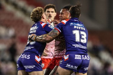 Tesi Niu of Leigh Leopards is tackled during the Betfred Super League play-off Eliminator 1 match Leigh Leopards vs Wakefield Trinity at Progress With Unity Stadium, Leigh, United Kingdom, 26th September 2025