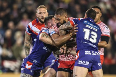 Isaac Liu of Leigh Leopards is tackled by Jay Pitts of Wakefield Trinity during the Betfred Super League play-off Eliminator 1 match Leigh Leopards vs Wakefield Trinity at Progress With Unity Stadium, Leigh, United Kingdom, 26th September 2025