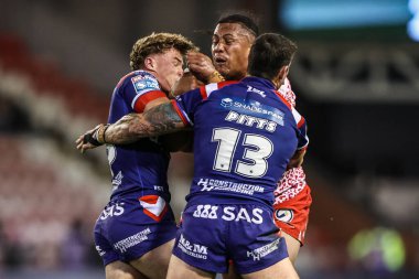Tesi Niu of Leigh Leopards is tackled during the Betfred Super League play-off Eliminator 1 match Leigh Leopards vs Wakefield Trinity at Progress With Unity Stadium, Leigh, United Kingdom, 26th September 2025