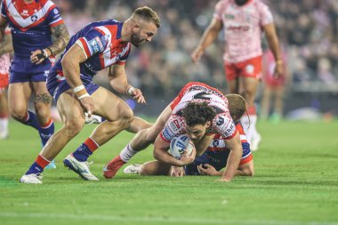 Lachlan Lam of Leigh Leopards is tackled during the Betfred Super League play-off Eliminator 1 match Leigh Leopards vs Wakefield Trinity at Progress With Unity Stadium, Leigh, United Kingdom, 26th September 2025 