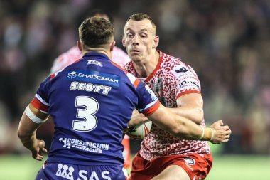 Frankie Halton of Leigh Leopards is tackled by Cam Scott of Wakefield Trinity during the Betfred Super League play-off Eliminator 1 match Leigh Leopards vs Wakefield Trinity at Progress With Unity Stadium, Leigh, United Kingdom, 26th September 2025