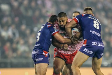 Isaac Liu of Leigh Leopards is tackled by Jay Pitts of Wakefield Trinity and Mike McMeeken of Wakefield Trinity during the Betfred Super League play-off Eliminator 1 match Leigh Leopards vs Wakefield Trinity at Progress With Unity Stadium 