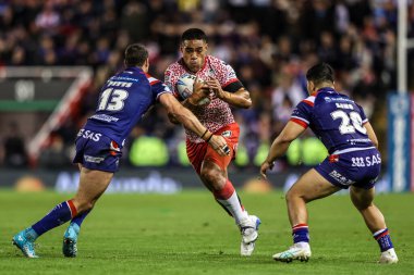 Joe Ofahengaue of Leigh Leapords is tackled by Jay Pitts of Wakefield Trinity and Mason Lino of Wakefield Trinity during the Betfred Super League play-off Eliminator 1 match Leigh Leopards vs Wakefield Trinity at Progress With Unity Stadium