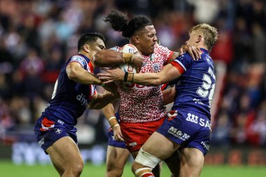 Tesi Niu of Leigh Leopards is tackled during the Betfred Super League play-off Eliminator 1 match Leigh Leopards vs Wakefield Trinity at Progress With Unity Stadium, Leigh, United Kingdom, 26th September 2025