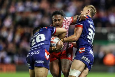 Tesi Niu of Leigh Leopards is tackled during the Betfred Super League play-off Eliminator 1 match Leigh Leopards vs Wakefield Trinity at Progress With Unity Stadium, Leigh, United Kingdom, 26th September 2025
