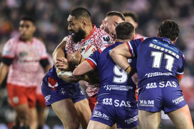 Isaac Liu of Leigh Leopards is tackled by Liam Hood of Wakefield Trinity during the Betfred Super League play-off Eliminator 1 match Leigh Leopards vs Wakefield Trinity at Progress With Unity Stadium, Leigh, United Kingdom, 26th September 2025