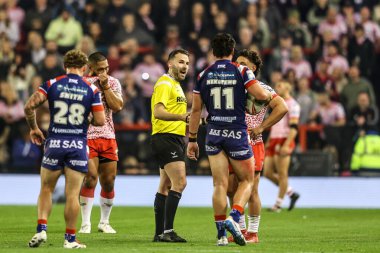 Referee Liam Moore has a chat with Seth Nikotemo of Wakefield Trinity and Lachlan Lam of Leigh Leopards after an incident on the pitch during the Betfred Super League play-off Eliminator 1 match Leigh Leopards vs Wakefield Trinity 