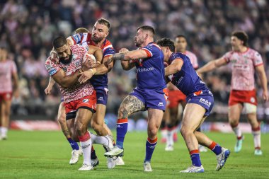 Isaac Liu of Leigh Leopards is tackled during the Betfred Super League play-off Eliminator 1 match Leigh Leopards vs Wakefield Trinity at Progress With Unity Stadium, Leigh, United Kingdom, 26th September 2025