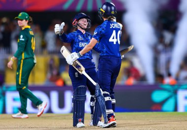 Tammy Beaumont of England and Amy Jones of England celebrating after winning the match during the ICC Women's World Cup match 04 England Women vs South Africa Women at ACA Barsapara Cricket Stadium, Guwahati, Assam / India, 3rd October 2025 