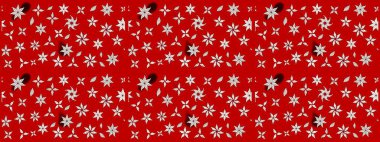 Raster çiçek desenleri çiziyor. Vadinin çiçekleri kırmızı renklerde.