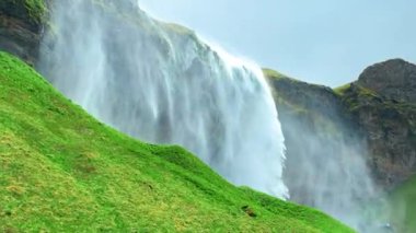 Seljalandsfoss waterfall, located in the South Region in Iceland right by Route 1. One of the most popular and beautiful waterfalls in Iceland