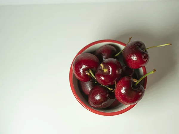 image of cherries in a Japanese cup