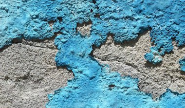 Eski mavi beton bir arka plan. Kimyasal bir reaksiyon ve iklimden kaynaklanan aşınma çatlakları var. Tasarım için soyut arkaplan ve doku..