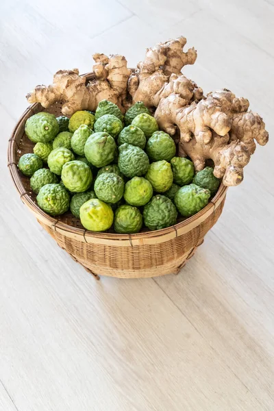 Basket full of kaffir lime and ginger with anti-oxidant and anti-inflammatory properties for well-being
