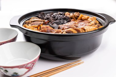 Lap mei fan or waxed meat rice is Chinese traditional dish that is served during Chinese New Year festive celebration. With two rice bowl ready to be served.