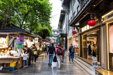 Kuanzhai alley in Chengdu Sichuan China is a cultural hub on ancient wide and narrow street with souvenirs, local folk art and dining specialties. clipart