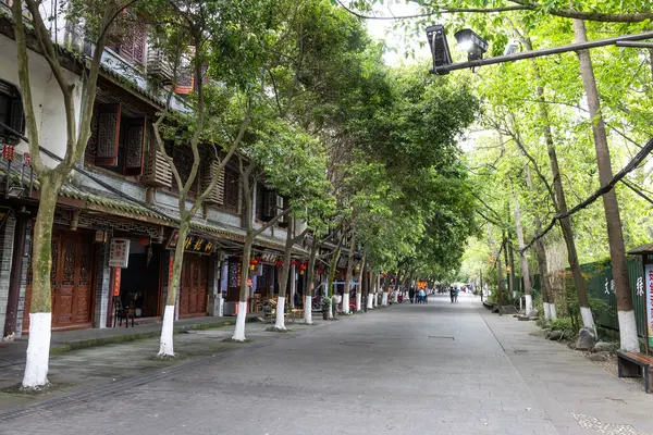 stock image Unidentified tourist walking along the street of Huanglongxi old ancient town, popular ancient landmark in Sichuan. China, with more than 2000 years of history