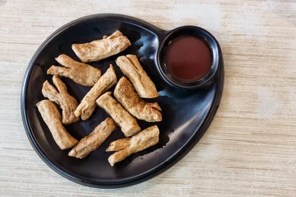 stock image Serving of authentic fried keropok lekor, popular traditional snack among locals in Kuala Terengganu in Malaysia