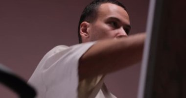 Portrait of Talented Young male artist drawing picture