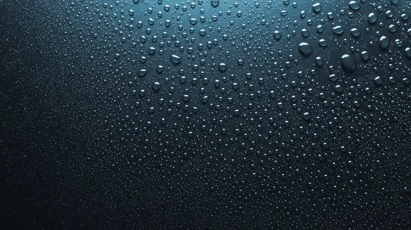 Pürüzsüz yüzeyde su damlalarının yakın plan görüntüsü, mavi arkaplan