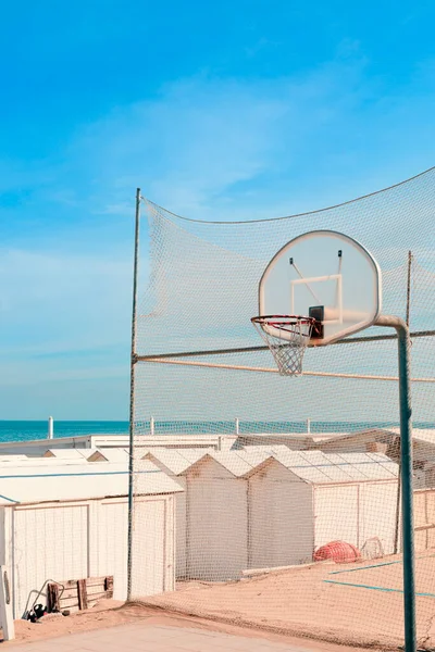 Beach playground, old basketball board, sea view