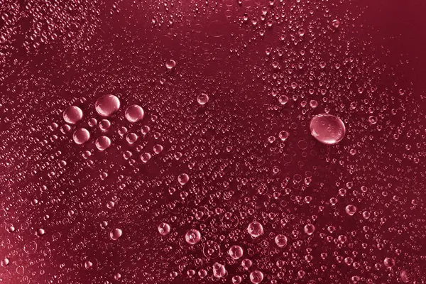 Bubbles Water Shaded Surface Red Background — Stock Photo, Image