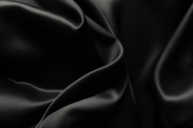 Dalgalı zarif siyah saten ipekten, doku arkaplanı