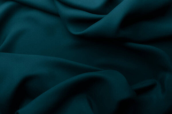 Elegant blue satin silk with waves, abstract background	