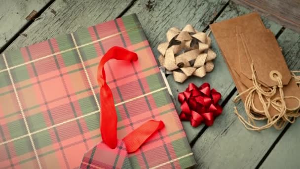 Christmas Background Gift Bag Tags Distressed Wood Background Medium Overhead — Vídeos de Stock