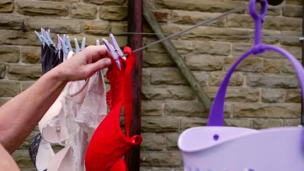 Housewife Hangs Laundry Out Washing Line Dry Medium Shot Slow — Stock Video